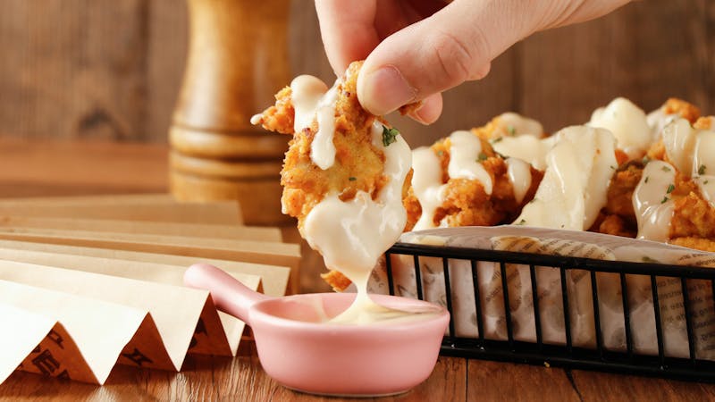 Garlic parmesan wings coated in savory cheese sauce