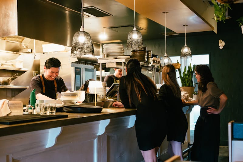 Restaurant counter and open kitchen at East Coast Wings
